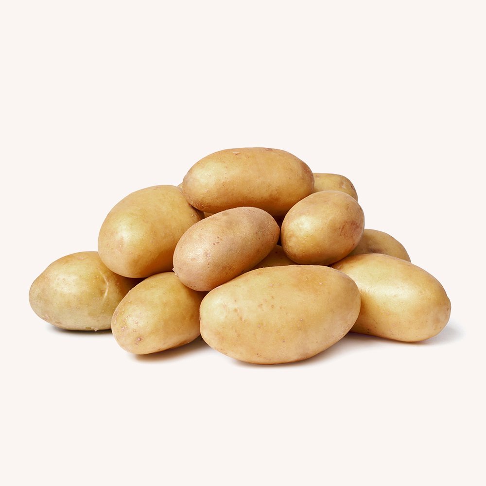 A pile of fresh, clean potatoes on a plain background.