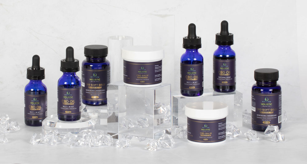 Blue skincare bottles on clear display stands.